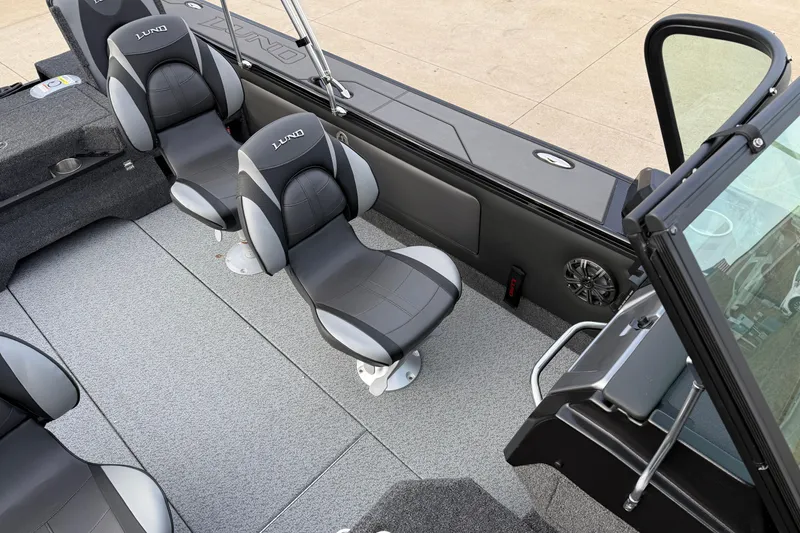 Slide: The Image of Interior of 2026 Lund 1975 Pro-V Sport boat with sleek seating and modern design. - 18