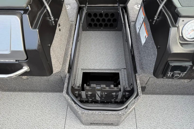 Slide: The Image of Interior of 2026 Lund 1975 Pro-V Sport boat, featuring storage compartment and control panel. - 19