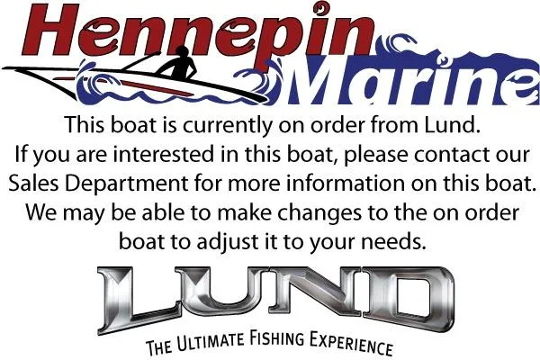 Slide: The Image of 2026 Lund 1975 Pro-V Sport boat on trailer outside showroom, featuring sleek black design. - 2