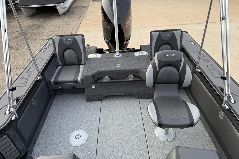 Slide: The Image of 2026 Lund 1975 Pro-V Sport boat interior with gray seating and modern design. - 31