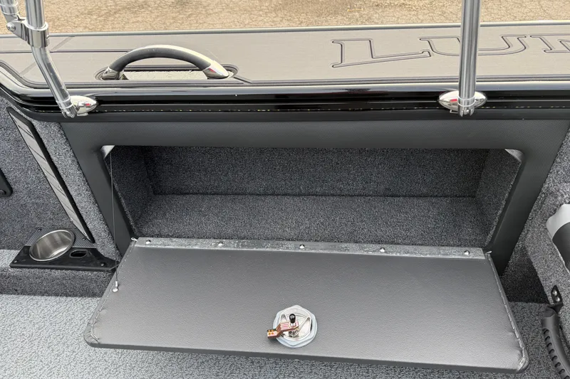 Slide: The Image of 2026 Lund 1975 Pro-V Sport boat interior storage compartment with open hatch. - 33