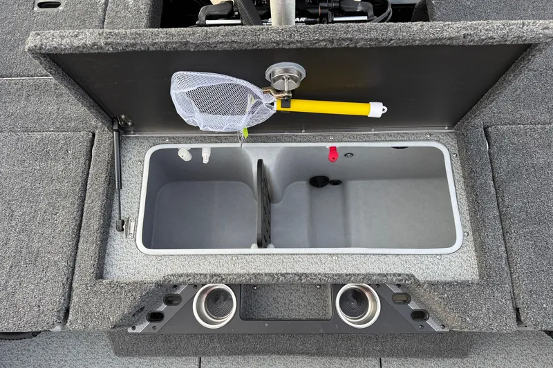 Slide: The Image of Open storage compartment in 2026 Lund 1975 Pro-V Sport boat with net and cup holders. - 36