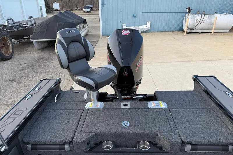 Slide: The Image of 2026 Lund 1975 Pro-V Sport boat with comfortable seating and powerful outboard motor. - 38