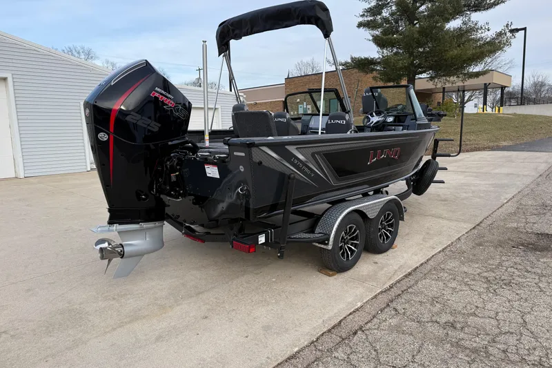 Slide: The Image of 2026 Lund 1975 Pro-V Sport boat on trailer with powerful outboard motor. - 6