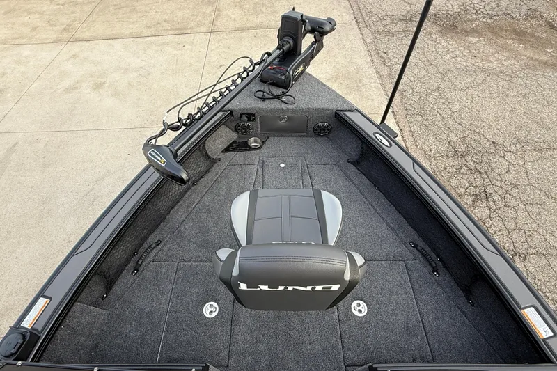 Slide: The Image of 2026 Lund 1975 Pro-V Sport boat interior with seating and trolling motor. - 9