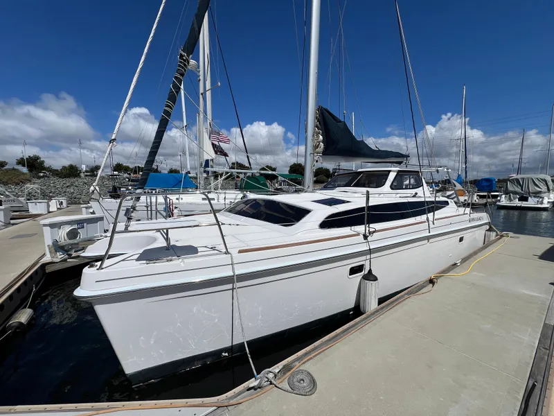 The Image of 2014 Gemini Legacy 35 sailboat docked at marina under clear blue sky. - 0