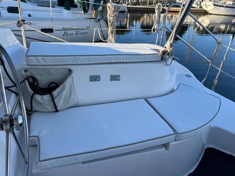Slide: The Image of 2014 Gemini Legacy 35 sailboat cockpit with cushioned seating and steering wheel. - 15
