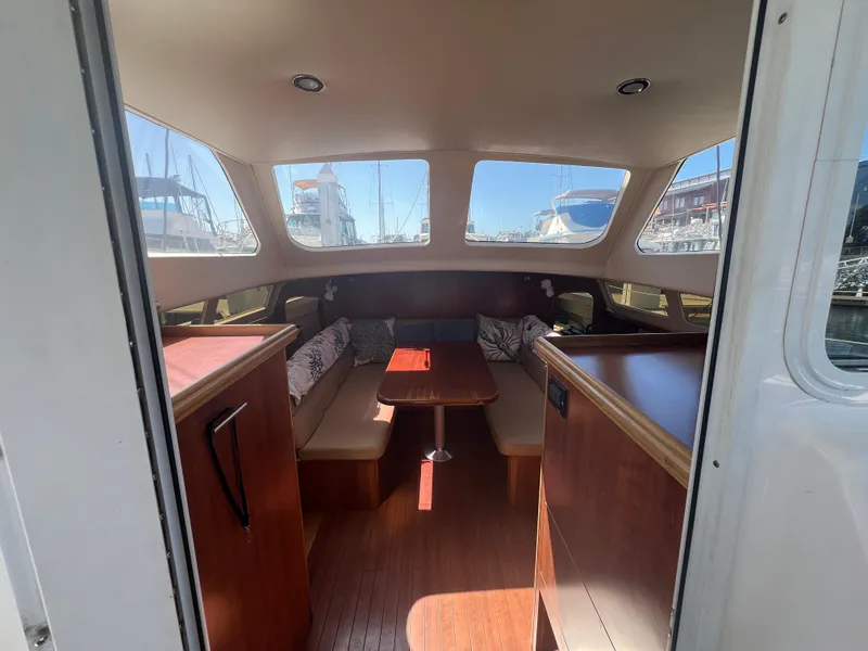 Slide: The Image of Interior of 2014 Gemini Legacy 35 catamaran with spacious seating and large windows. - 18