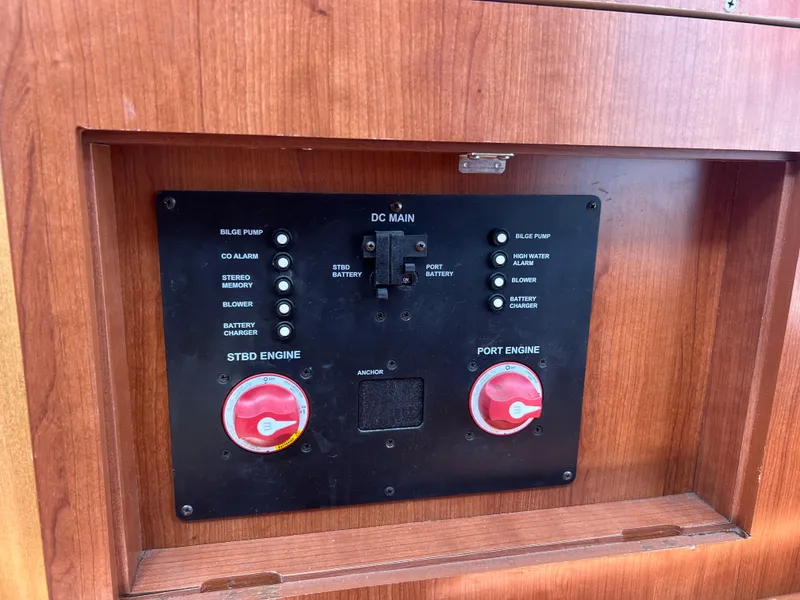 Slide: The Image of Control panel of a 2014 Gemini Legacy 35 boat with engine switches. - 21