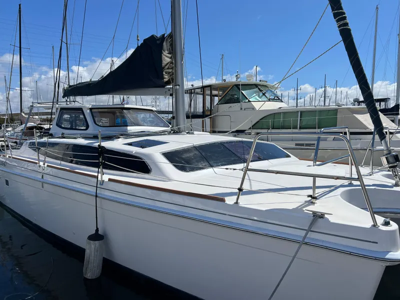 Slide: The Image of 2014 Gemini Legacy 35 sailboat docked at marina under clear blue sky. - 4