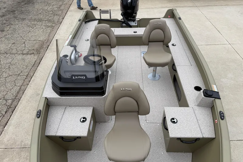 Slide: The Image of 2026 Lund 1675 Alaskan SS boat interior with seating and steering console. - 10