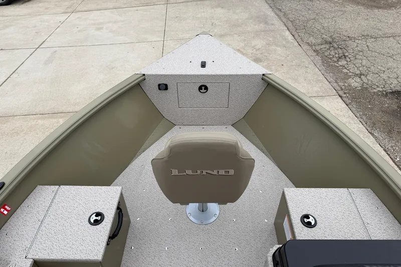 Slide: The Image of 2026 Lund 1675 Alaskan SS boat interior with seating and storage compartments. - 13