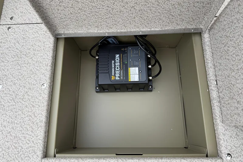 Slide: The Image of Battery compartment of 2026 Lund 1675 Alaskan SS with Minn Kota Precision charger. - 20