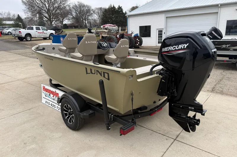 Slide: The Image of 2026 Lund 1675 Alaskan SS boat with Mercury engine on trailer, outdoor display. - 7