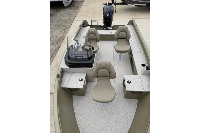 Slide: The Image of 2026 Lund 1675 Alaskan SS boat interior with seating and steering console. - 9