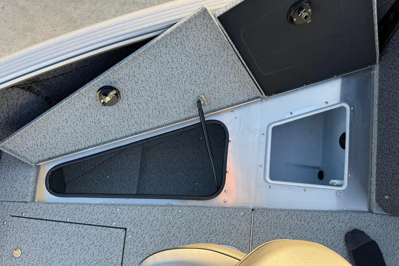 Slide: The Image of 2026 Lund 1875 Impact XS Sport boat interior storage compartments. - 15
