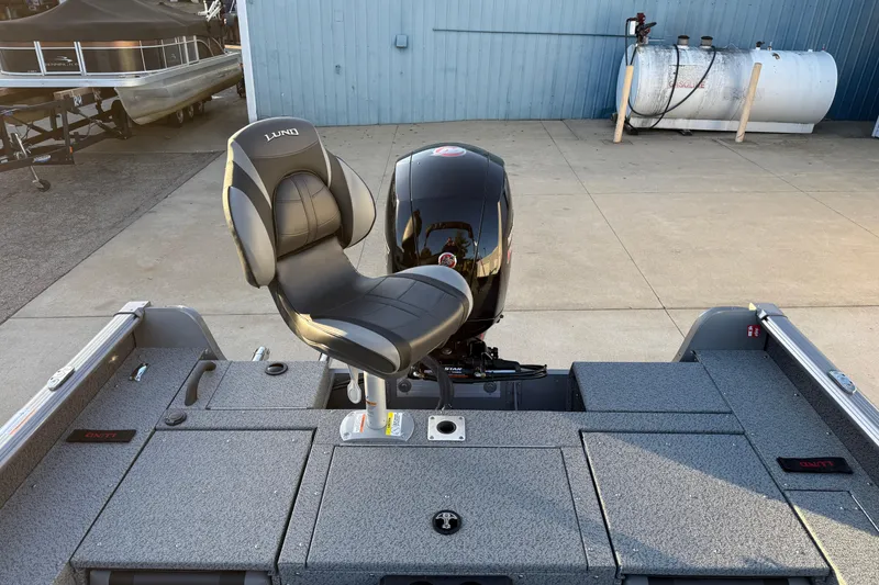 Slide: The Image of 2026 Lund 1875 Impact XS Sport boat with a comfortable seat and powerful motor. - 30