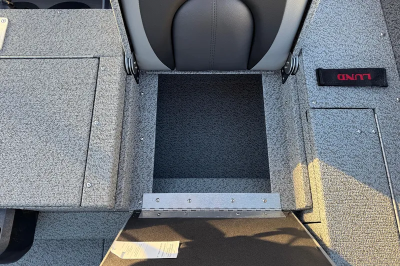 Slide: The Image of 2026 Lund 1875 Impact XS Sport boat interior with open storage compartment. - 32
