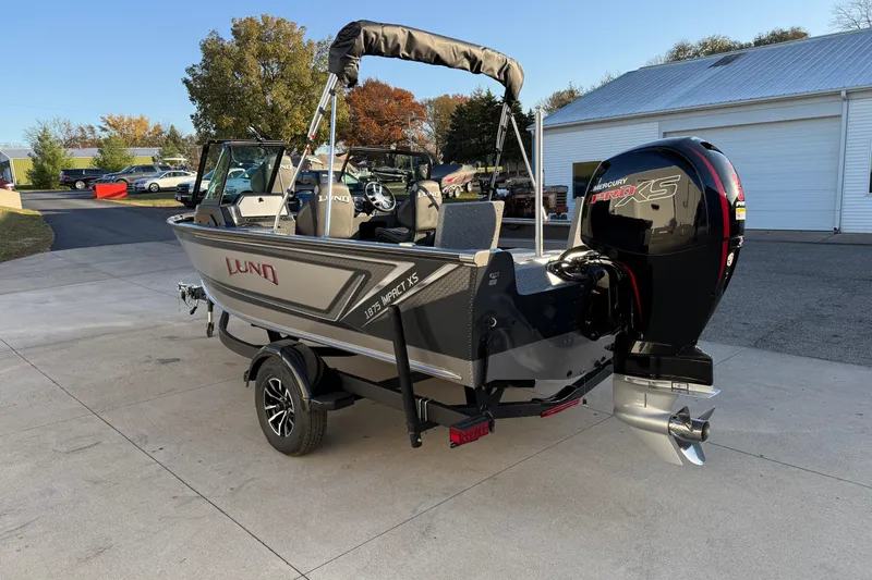 Slide: The Image of 2026 Lund 1875 Impact XS Sport boat with Mercury Pro XS engine on trailer. - 8