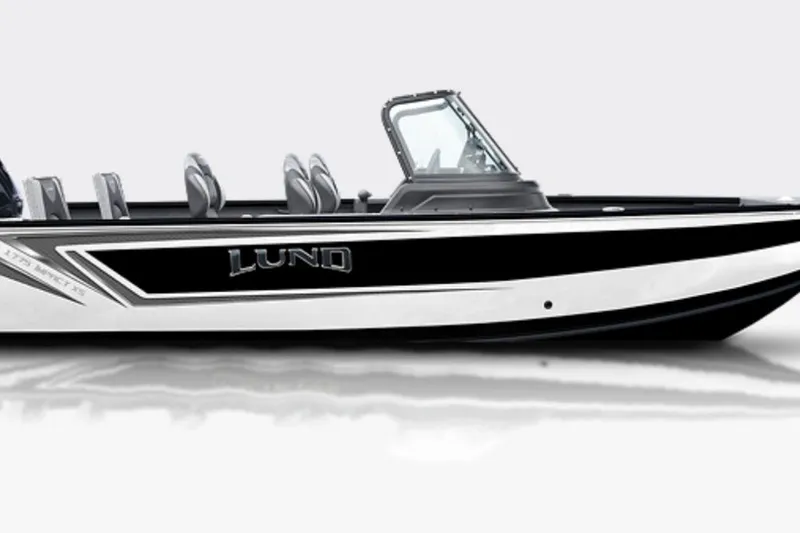 The Image of 2026 Lund 1775 Impact XS Sport boat on trailer outside showroom. - 0