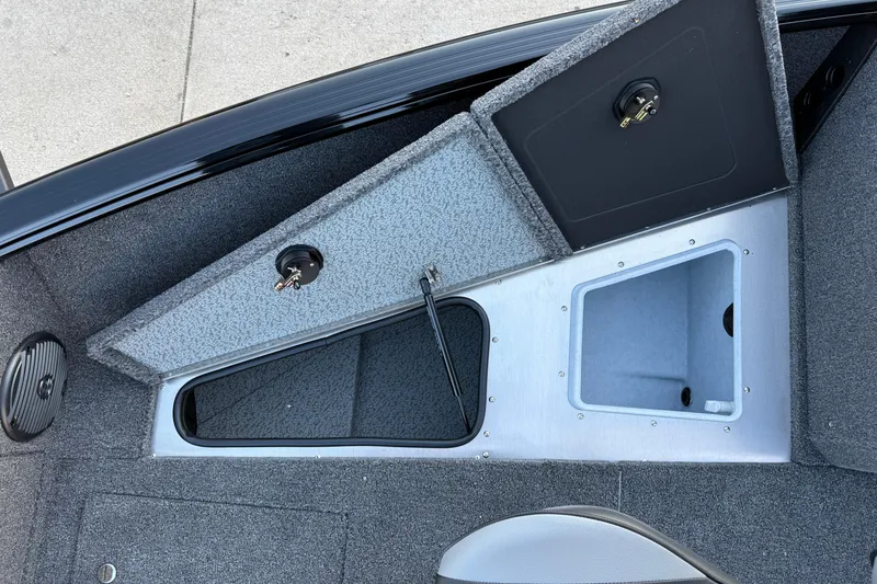 Slide: The Image of 2026 Lund 1775 Impact XS Sport boat storage compartments with open hatches. - 12