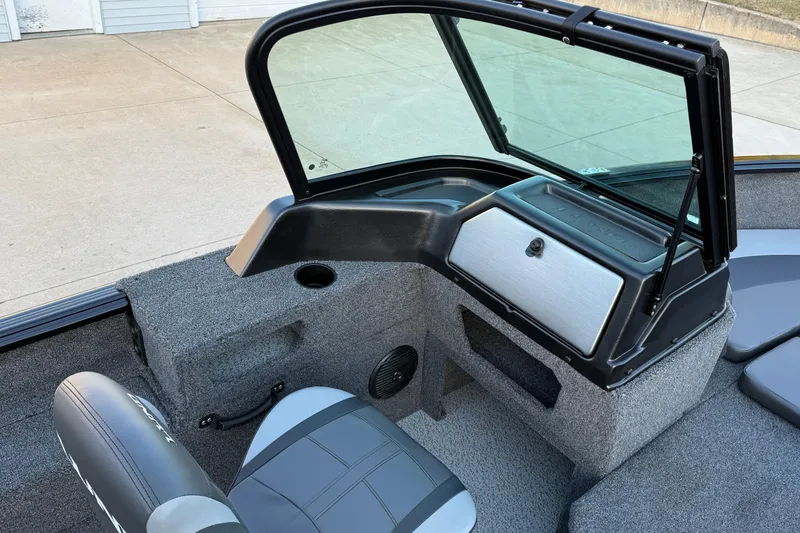 Slide: The Image of 2026 Lund 1775 Impact XS Sport boat interior with seating and windshield. - 17