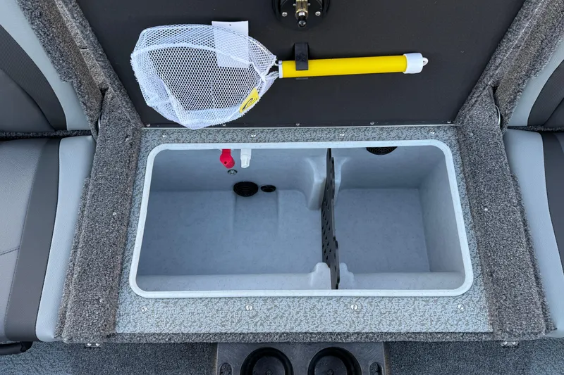 Slide: The Image of 2026 Lund 1775 Impact XS Sport boat storage compartment with net and yellow handle. - 23