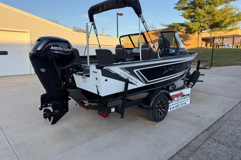 Slide: The Image of 2026 Lund 1775 Impact XS Sport boat with Mercury engine on trailer. - 7