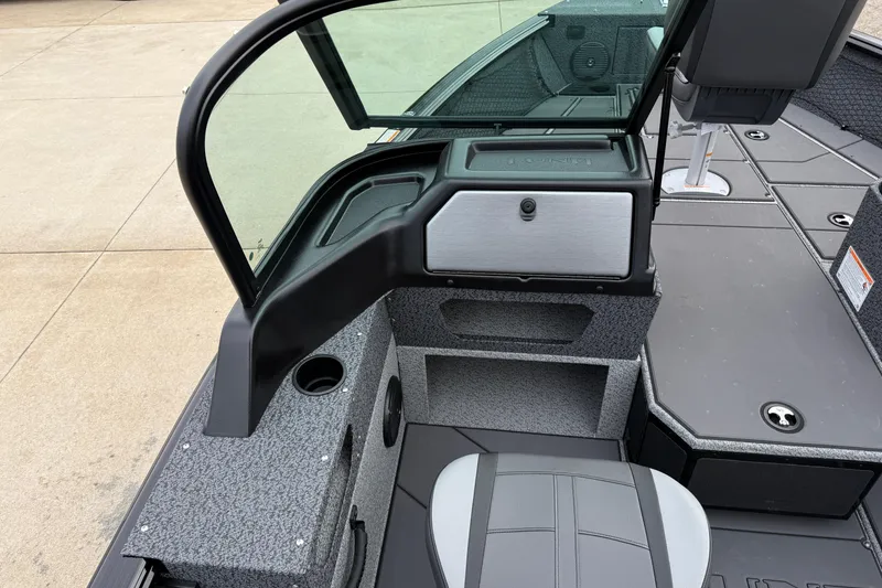 Slide: The Image of 2026 Lund 1775 Impact XS Sport boat interior with seating and storage compartments. - 20