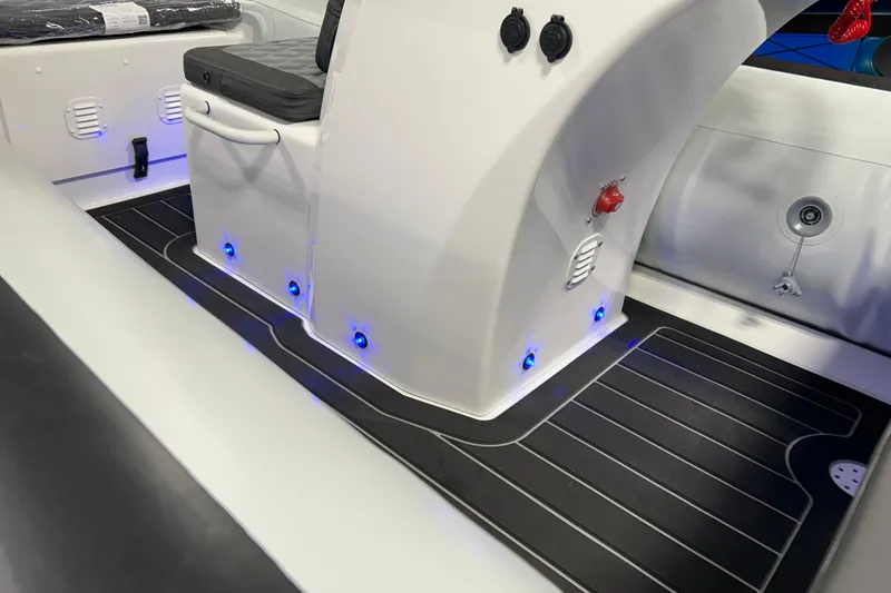 Slide: The Image of 2026 Highfield Sport 390 boat interior with sleek design and blue LED lighting. - 13