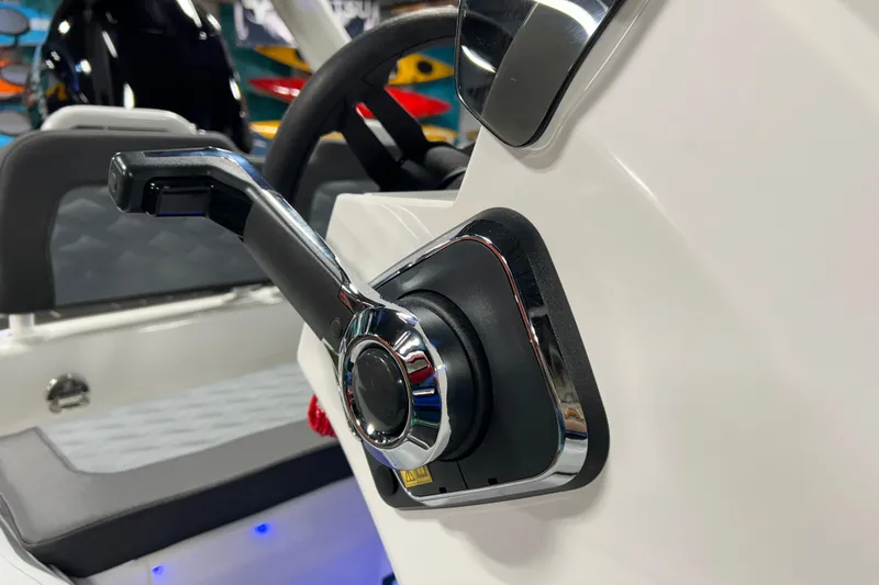 Slide: The Image of Close-up of 2026 Highfield Sport 390 boat throttle control in sleek interior setting. - 15
