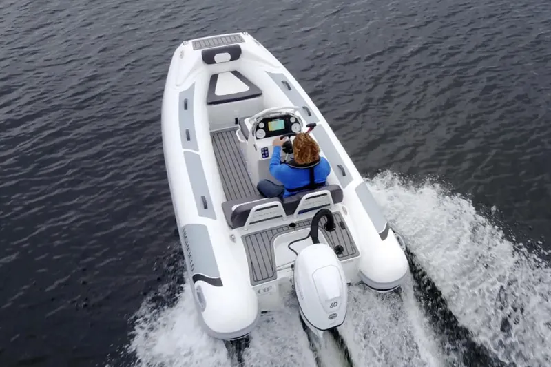 Slide: The Image of Manufacturer Provided Image: 2025 Highfield Sport 390 boat cruising on water, rear view. - 3