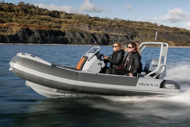 Slide: The Image of Manufacturer Provided Image: 2025 Highfield Sport 390 boat cruising on a scenic lake. - 5