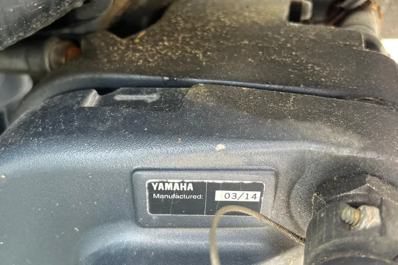 Slide: The Image of Yamaha engine part with manufacturing date 03/14 on a 2015 Robalo R227 Dual Console. - 51