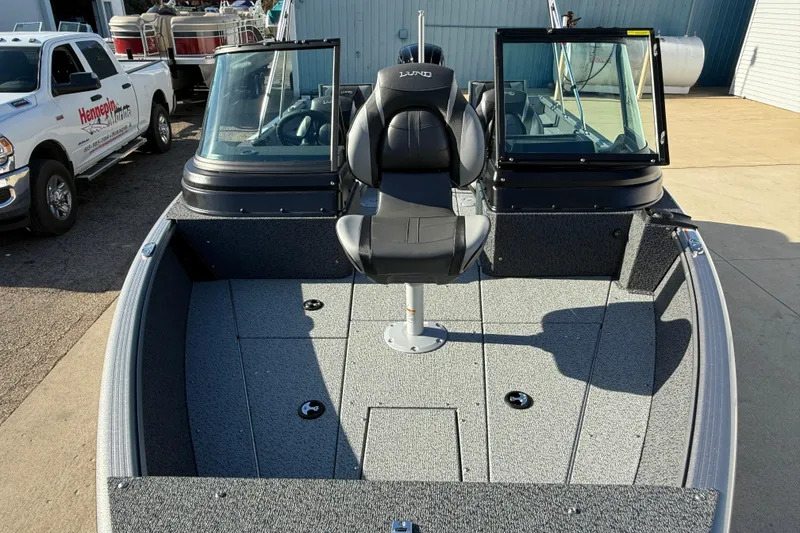 Slide: The Image of 2026 Lund 1775 Impact XS Sport boat with central seating and dual windshields. - 10