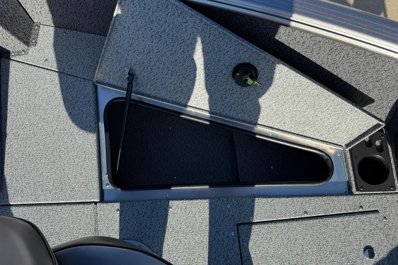 Slide: The Image of 2026 Lund 1775 Impact XS Sport boat interior storage compartment. - 11