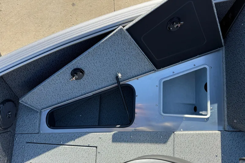 Slide: The Image of 2026 Lund 1775 Impact XS Sport boat interior storage compartments. - 12