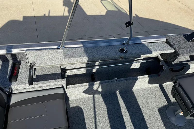 Slide: The Image of 2026 Lund 1775 Impact XS Sport boat interior with seating and storage compartments. - 23