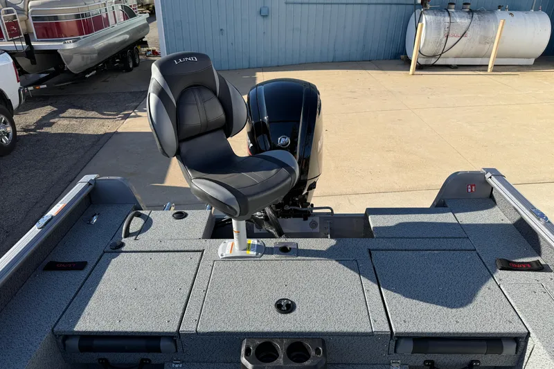 Slide: The Image of 2026 Lund 1775 Impact XS Sport boat with a comfortable seat and powerful motor. - 25