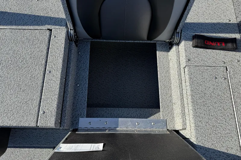 Slide: The Image of 2026 Lund 1775 Impact XS Sport boat interior storage compartment. - 27