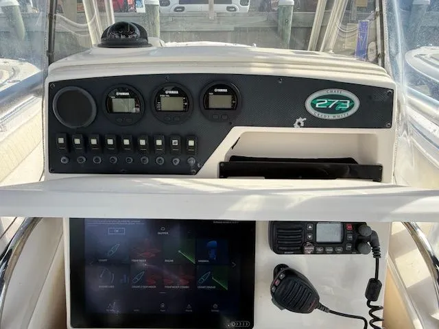 Slide: The Image of Control panel of 2005 Grady-White Chase 273 boat with gauges and navigation equipment. - 10