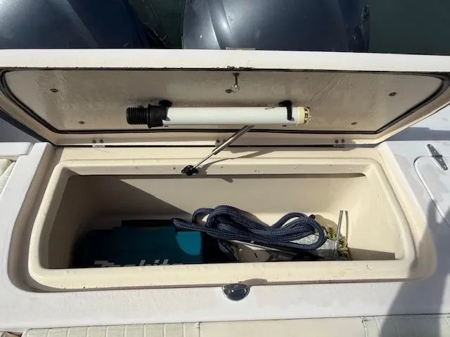 Slide: The Image of Storage compartment on a 2005 Grady-White Chase 273 boat with equipment and rope. - 6
