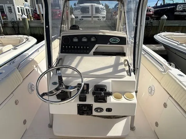 Slide: The Image of 2005 Grady-White Chase 273 boat cockpit with steering wheel and control panel. - 8