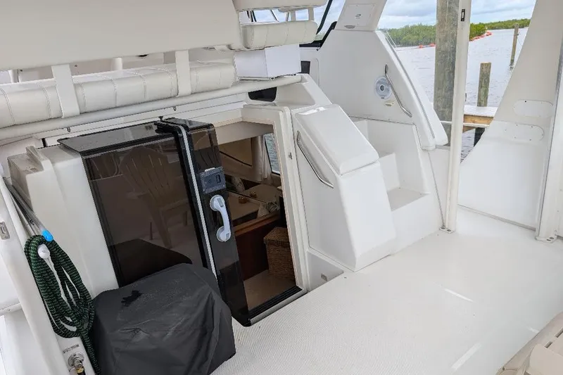 Slide: The Image of 2003 Carver 356 Motor Yacht interior with sleek white design and modern amenities. - 11