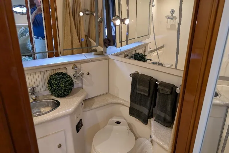 Slide: The Image of Bathroom interior of 2003 Carver 356 Motor Yacht with modern fixtures and decor. - 25