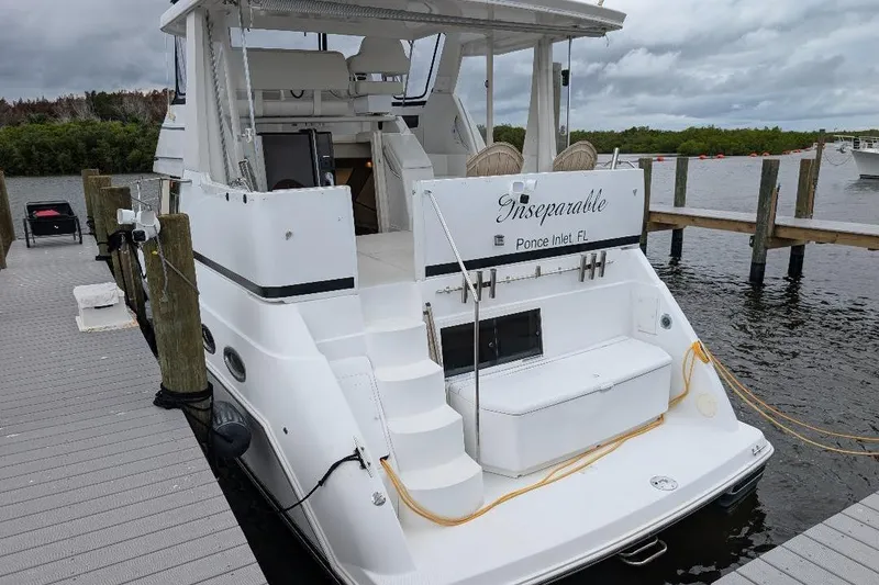 Slide: The Image of 2003 Carver 356 Motor Yacht docked at marina, named "Inseparable," Ponce Inlet, FL. - 4