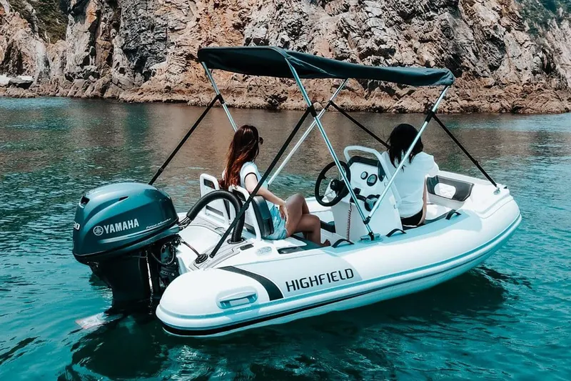 Slide: The Image of Manufacturer Provided Image: 2025 Highfield Sport 330 boat with Yamaha engine on scenic water. - 10