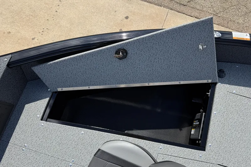 Slide: The Image of Open storage compartment on 2026 Lund 1800 Explorer Tiller boat. - 11