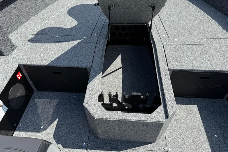 Slide: The Image of 2026 Lund 1800 Explorer Tiller boat interior with open storage compartments. - 13