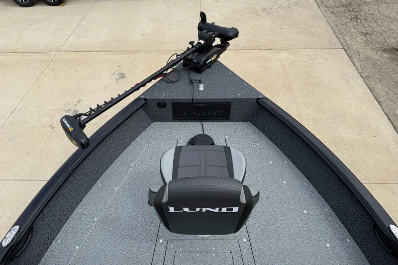 Slide: The Image of 2026 Lund 1800 Explorer Sport boat interior with trolling motor and seating. - 9